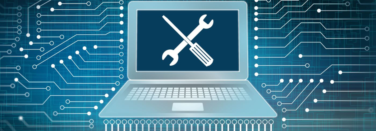 An image of a computer against a cyber background, with a screwdriver and wrench crossed over the screen.