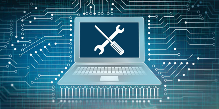 An image of a computer against a cyber background, with a screwdriver and wrench crossed over the screen.
